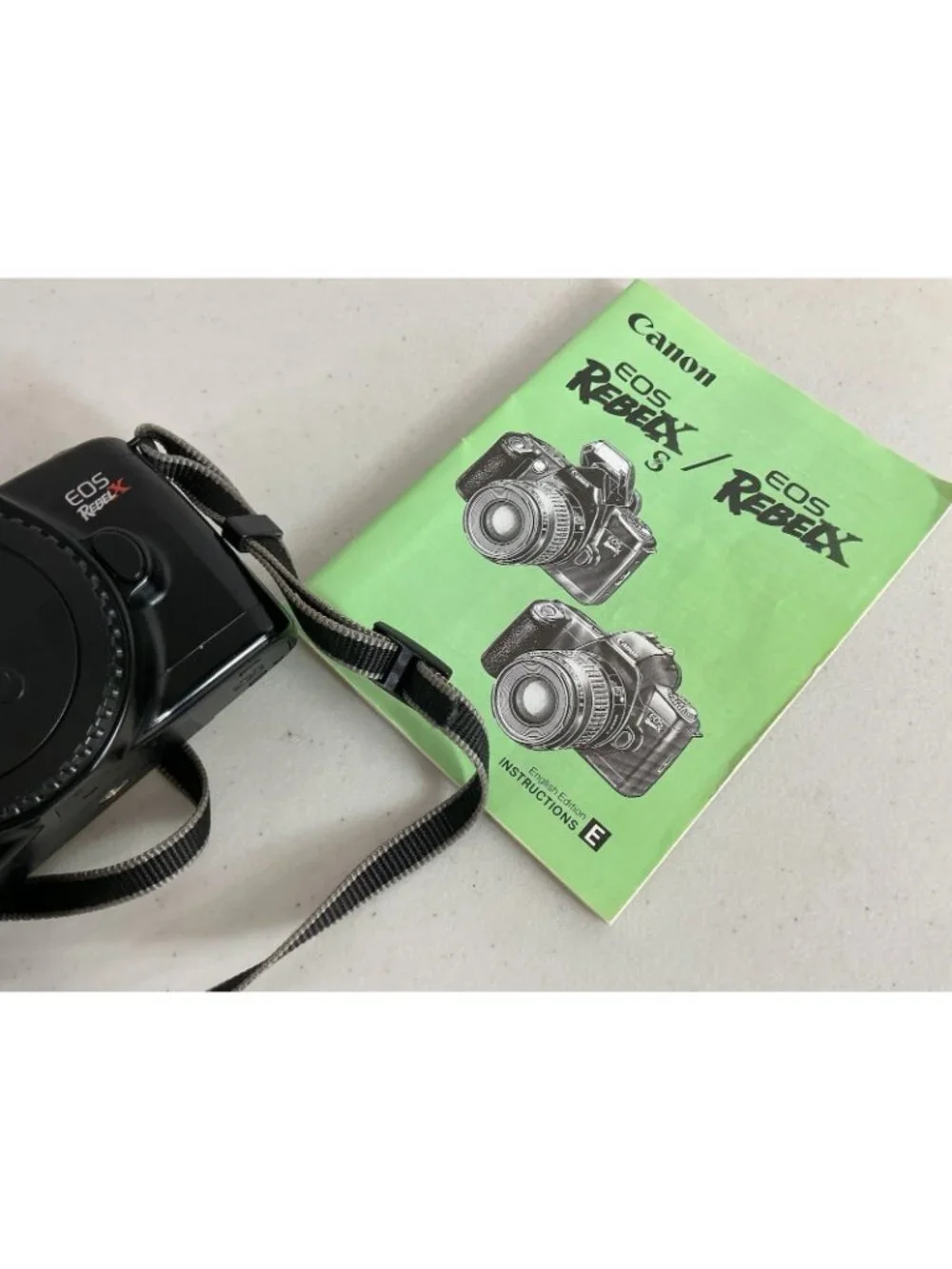 Canon EOS Rebel X S 35mm SLR Film Camera with Strap & Booklet Film Included
